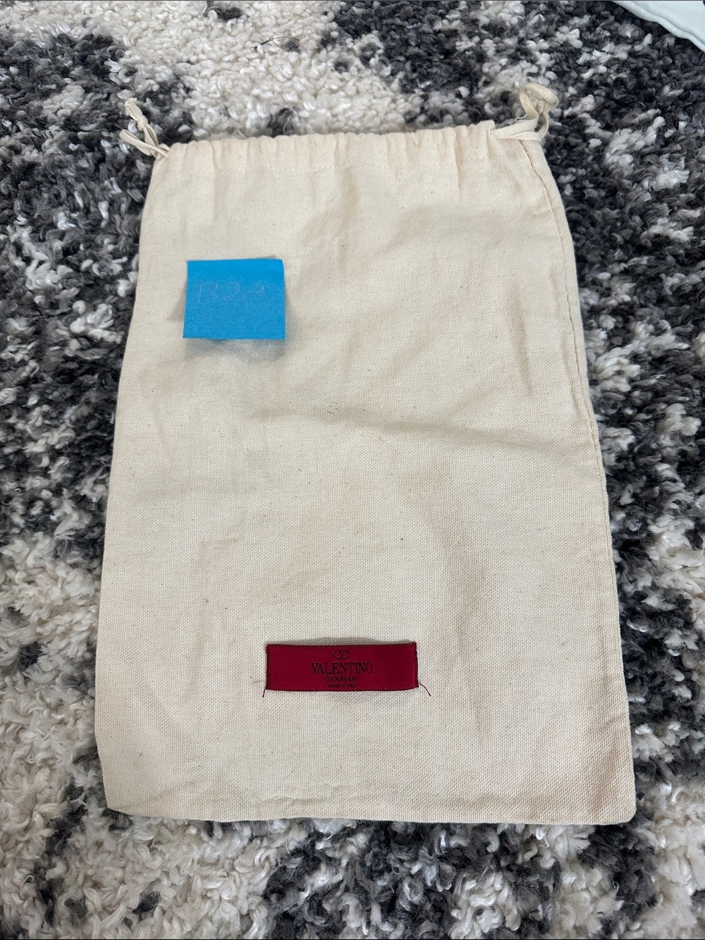 Valentino beige canvas dust bag with red logo patch